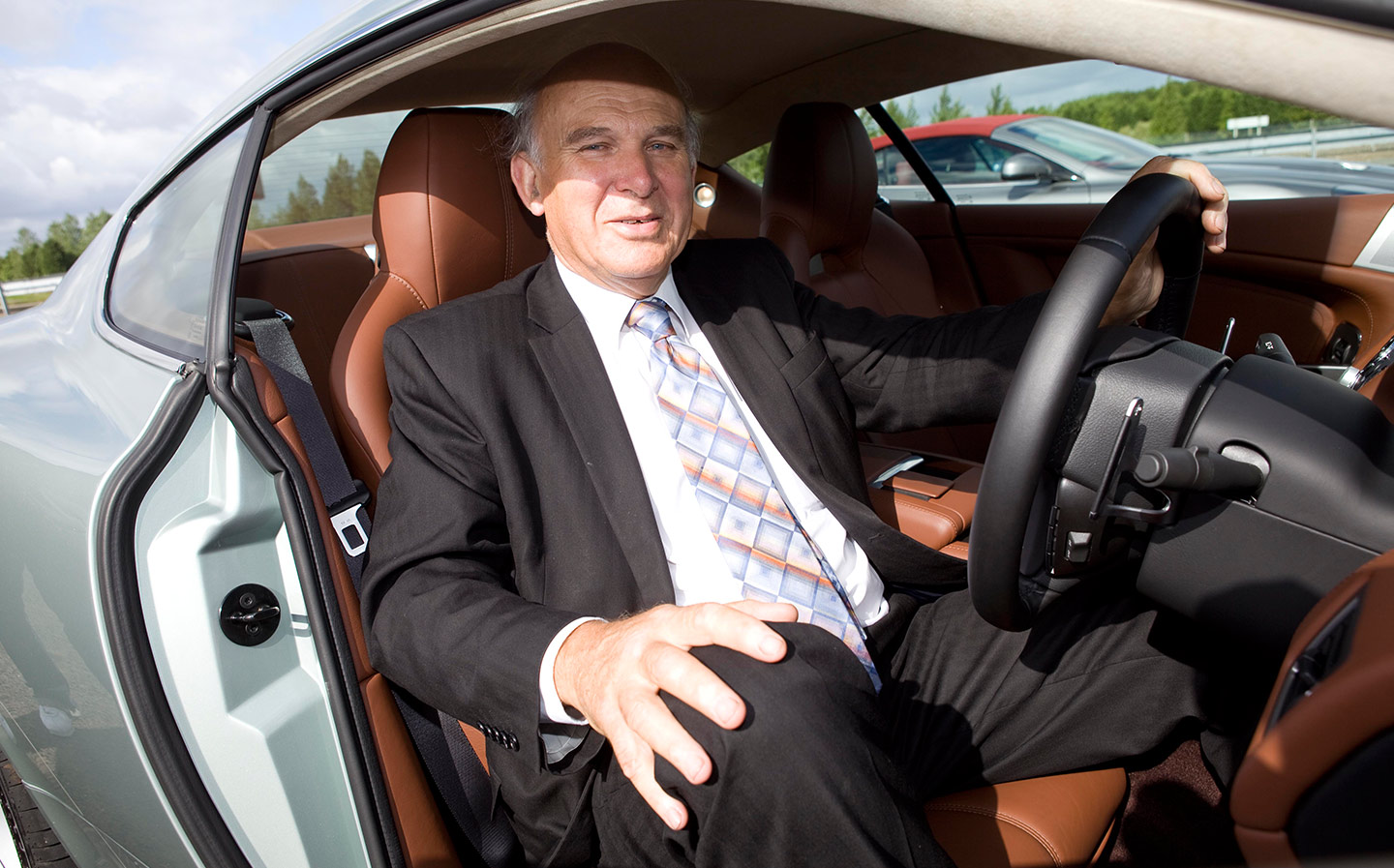 Vince Cable drives the 190mph Aston Martin Rapide S