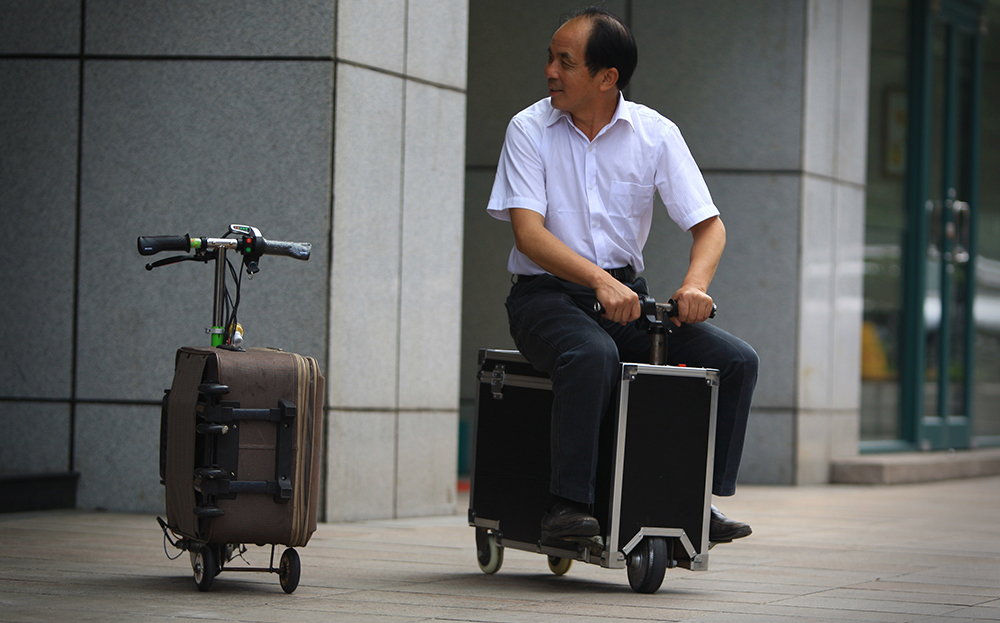 He Liangcai, Chinese former farmer creates electric suitcase scooter