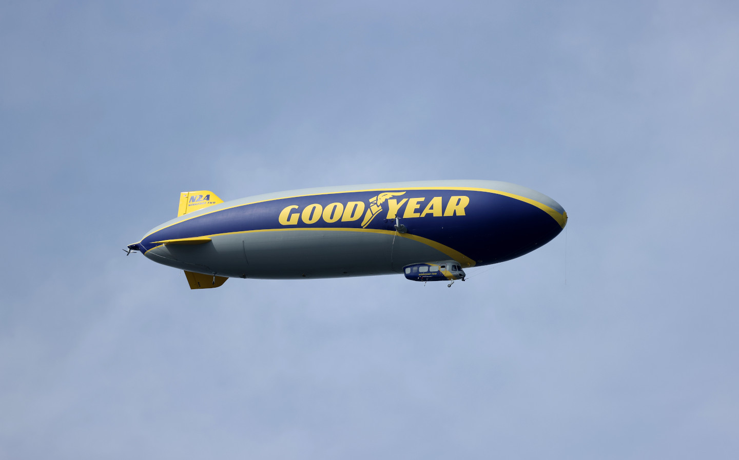 Goodyear Blimp visible over London skyline