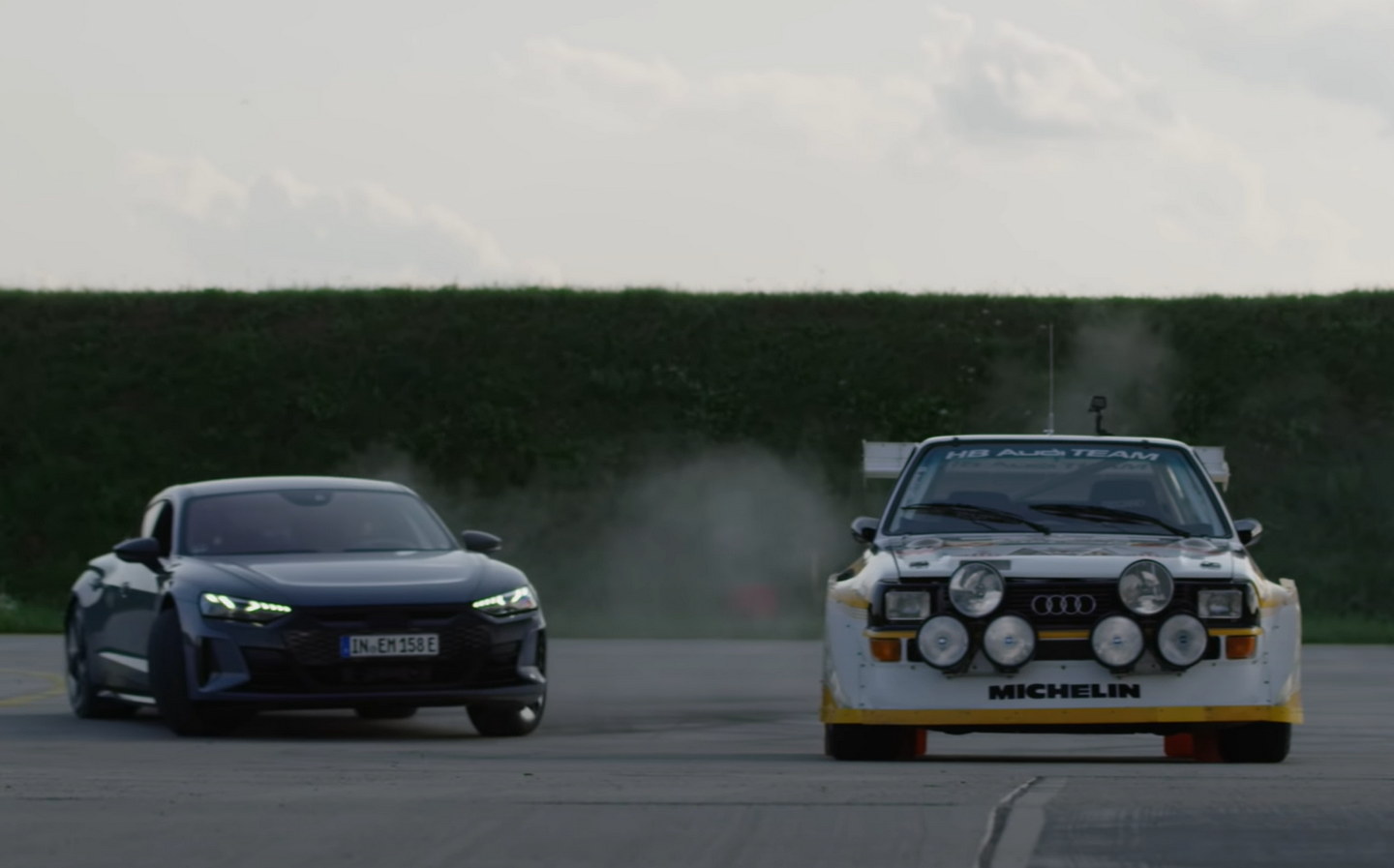 Ken Block drifts the Audi e-tron RS GT around the Sport Quattro rally car