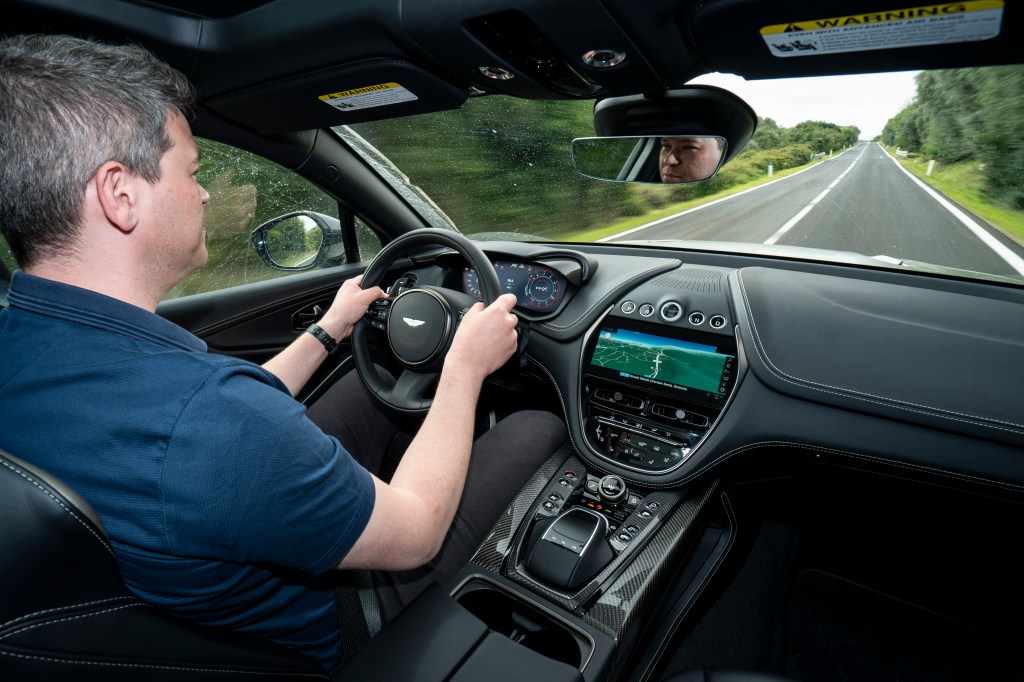 Will Dron driving the Aston Martin DBX707