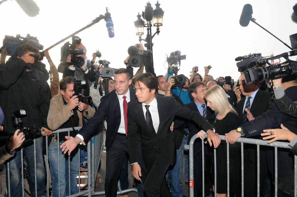 Brazilian F1 driver Nelson Piquet Jr (C) arrives at FIA headquarters in Paris on September 21, 2009 for an hearing at the World Motor Sports Council after the 2008 Singapore Grand Prix "crashgate" affair, involving the Renault F1 team. This event has left the company facing sanctions for cheating after Nelson Piquet Jr claimed. Former team chief Flavio Briatore sensationally quit Renault on September 18, 2009 with chief engineering director Pat Symonds as Renault admitted their guilt in the September 2008 car crash. AFP PHOTO BORIS HORVAT (Photo credit should read BORIS HORVAT/AFP via Getty Images)