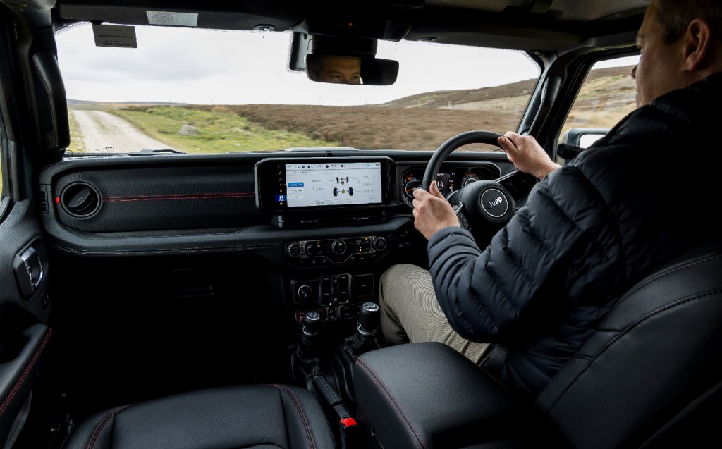 Will Dron driving the Jeep Wrangler Rubicon 2024